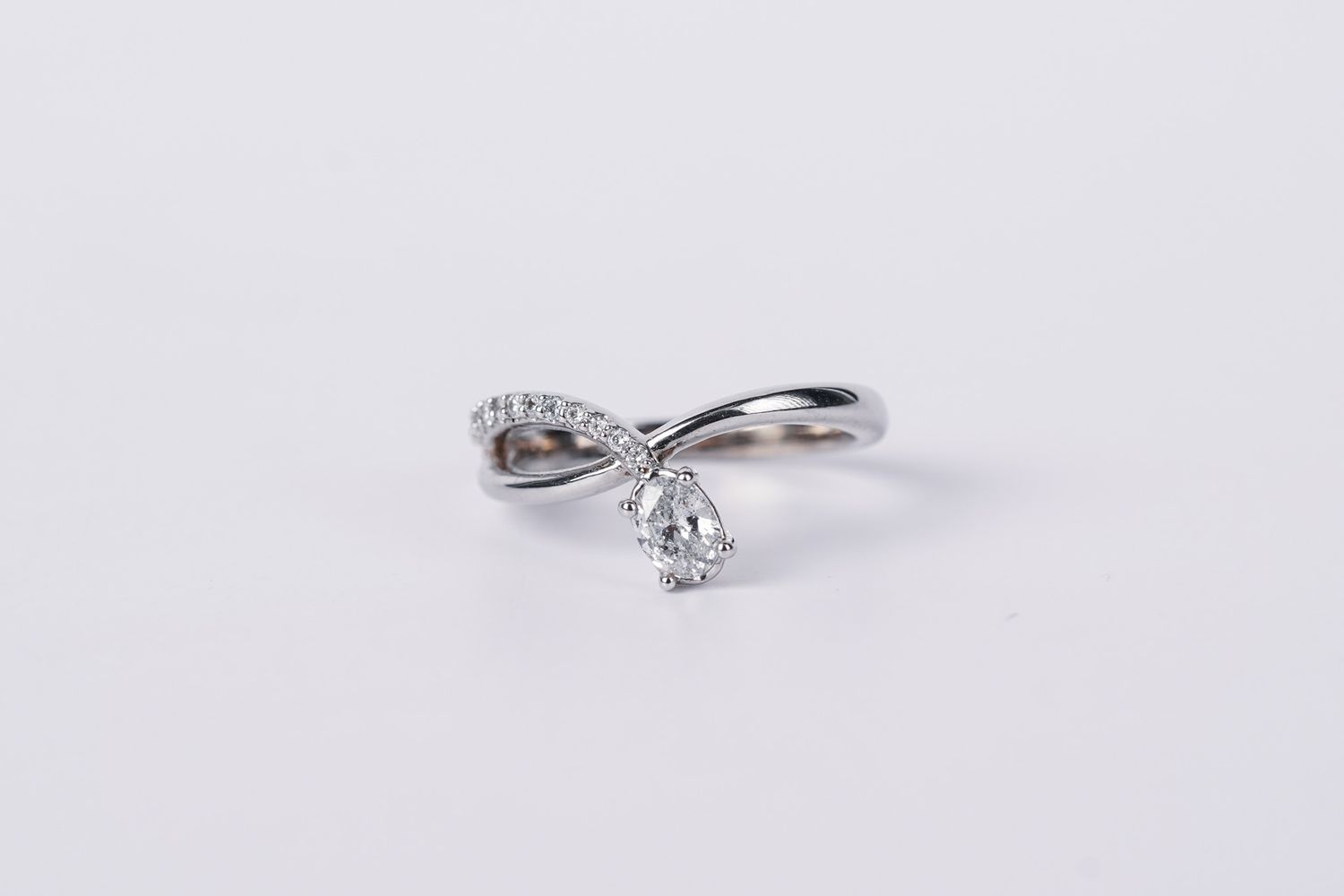 BETX- 14KW 3.50g .70ctw (.50ctr) Pear Diamond Bypass Ring (size 7)