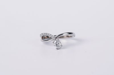 BETX- 14KW 3.50g .70ctw (.50ctr) Pear Diamond Bypass Ring (size 7)