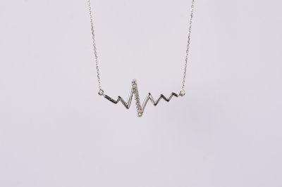 VTV- 10KW 1.33g .04ctw Diamond Heartbeat Pendant 16-18&quot;