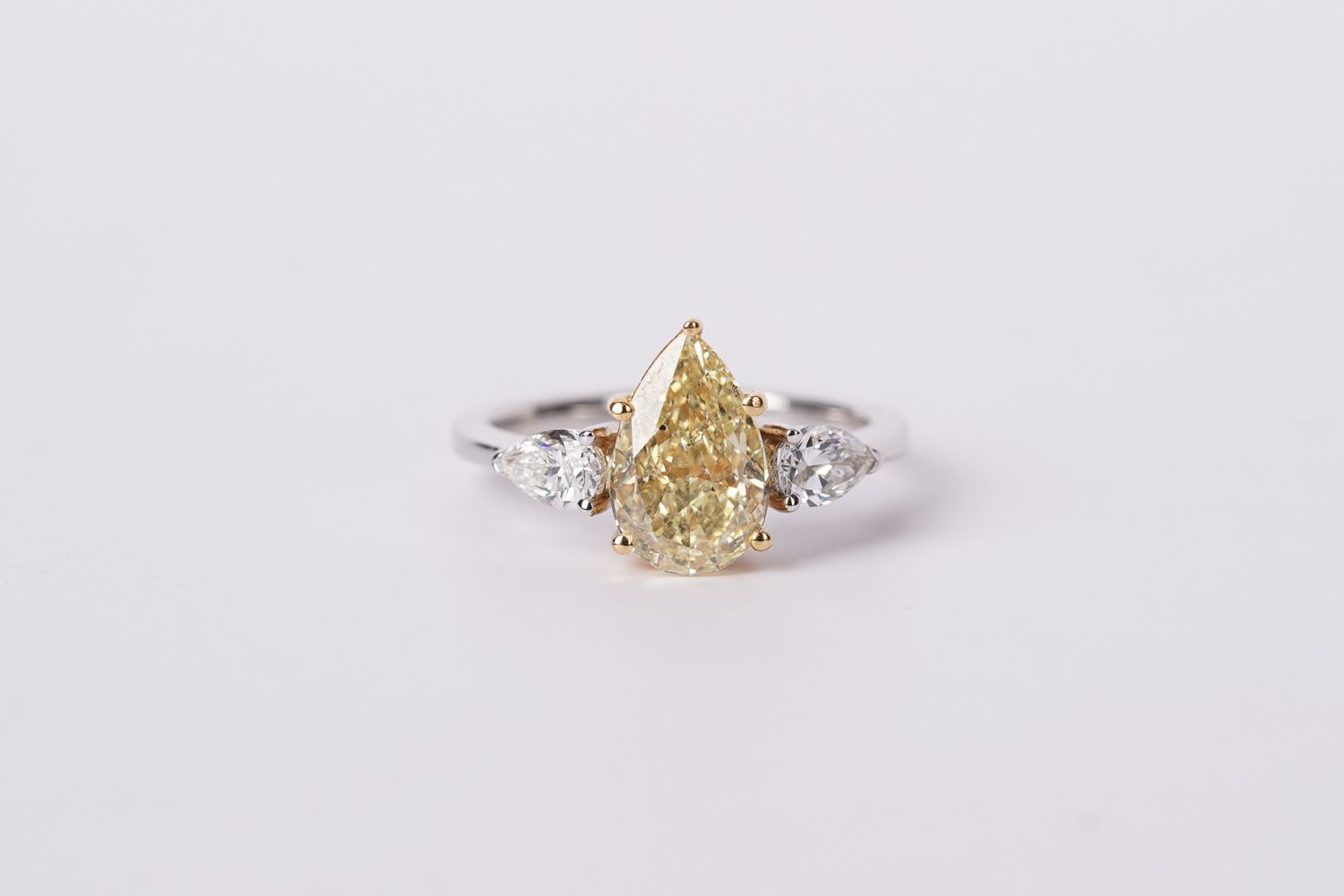 IETTX-18KWY 4.26g 2.55ctw (2.05ctr) FY/SI2 GIA Pear Diamond Three-Stone Ring (size 6)