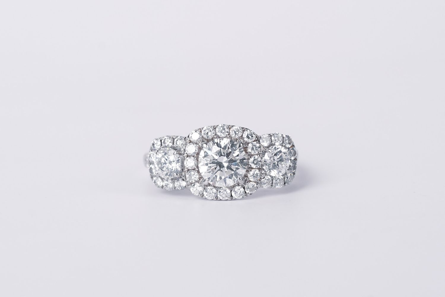DVTT-18KW 5.03g 2.24ctw (1.08ctr) I/SI1 Three Stone Halo Engagement Ring (size 7)