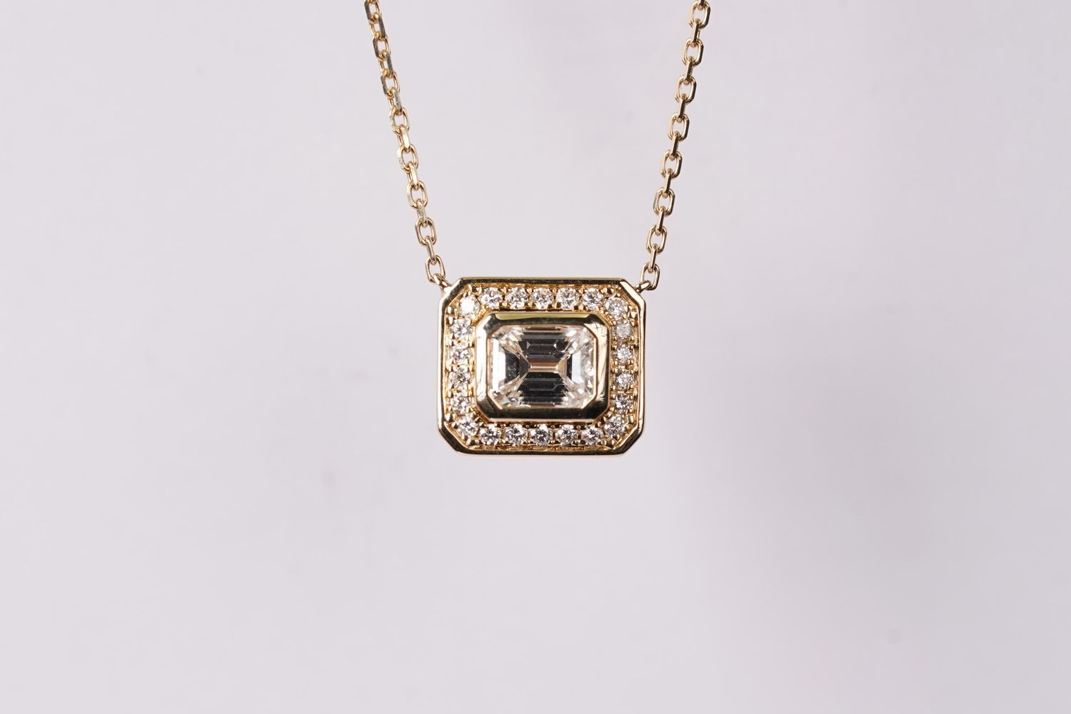 LTTX- 14KY 2.68g .60ctw (.49ctr) Emerald Diamond Halo Pendant 16-18&quot;