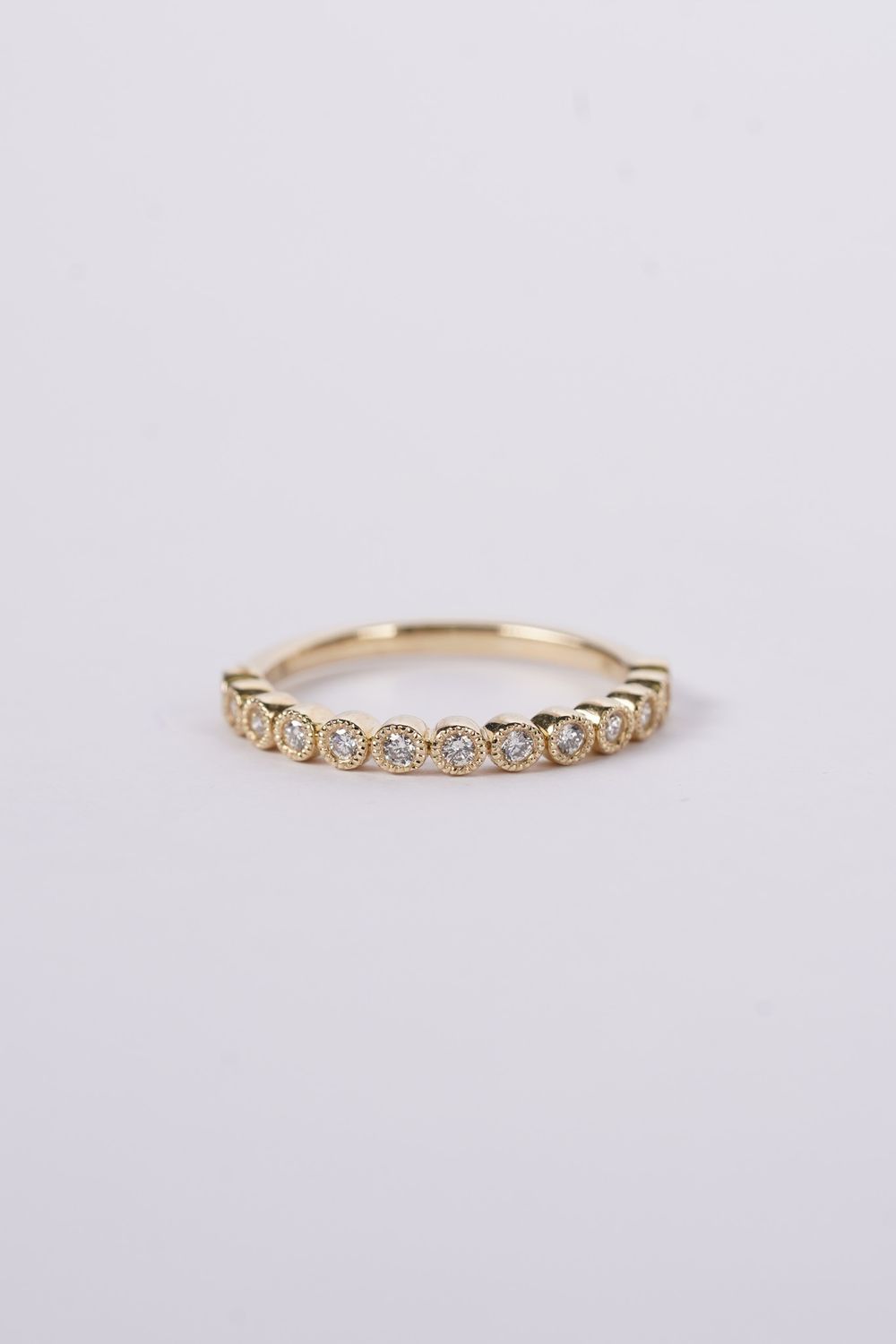 NTT- 14KY 2.2g .20ctw Diamond Milgrain Bezel Stackable Band (size 7)
