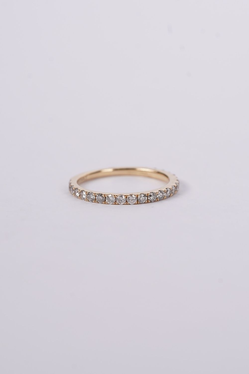 14KY 1.9g .60tw Diamond Shared Prong Stackable Band (size 7.25)