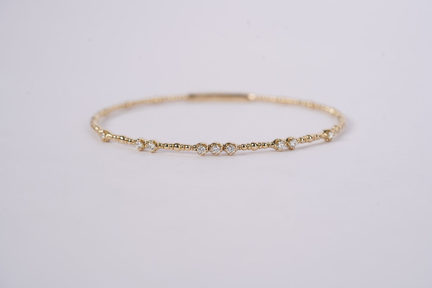 BTTX- 14KY 5.20g .32ctw Diamond Flex Bangle Bracelet