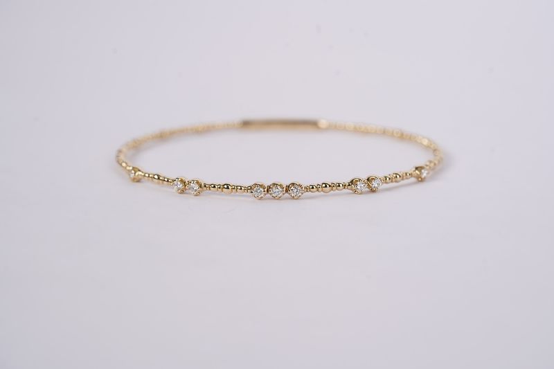 BTTX- 14KY 5.20g .32ctw Diamond Flex Bangle Bracelet