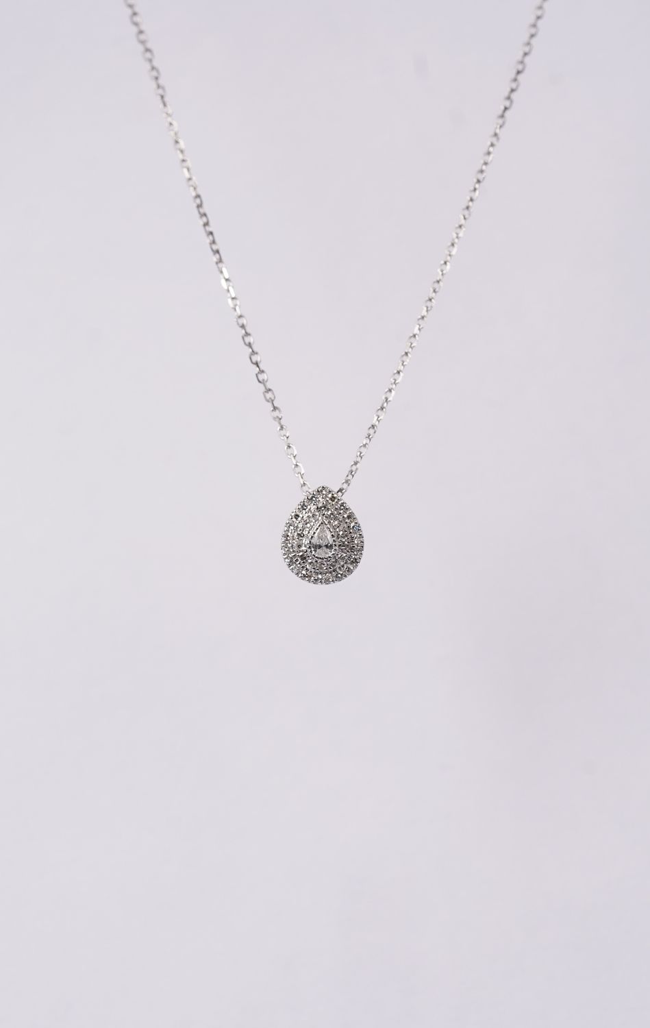 DDTX- 18KW 1.55g .06ctw Diamond Pear Halo Necklace 16-18&quot;