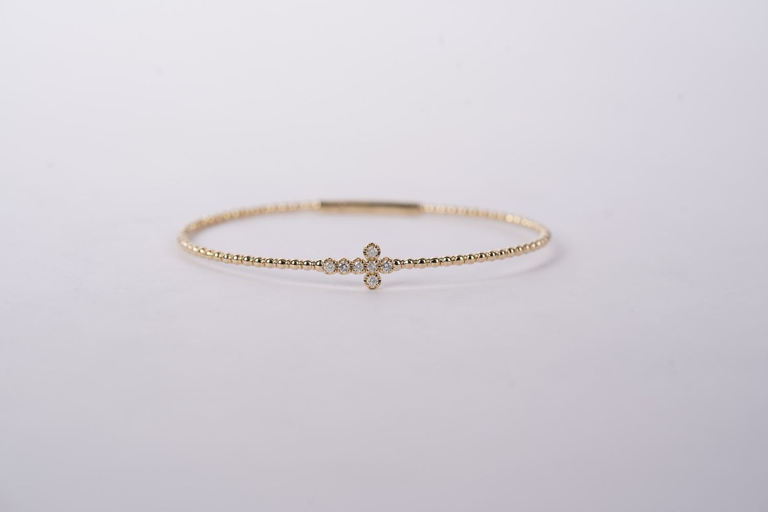 BBEX- 14KY 4.54g .20ctw Diamond Cross Bangle Bracelet