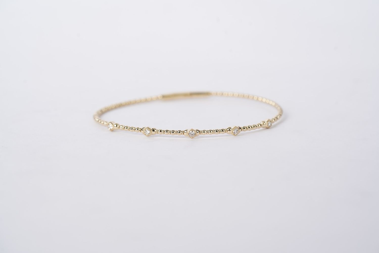 RTTX- 14KY 4.86g .18ctw Diamond Flex Bangle
