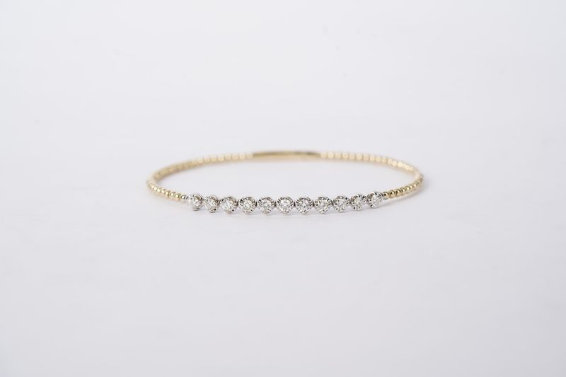 VVBT- 14KWY 6.76g .88ctw Diamond Flex Bangle