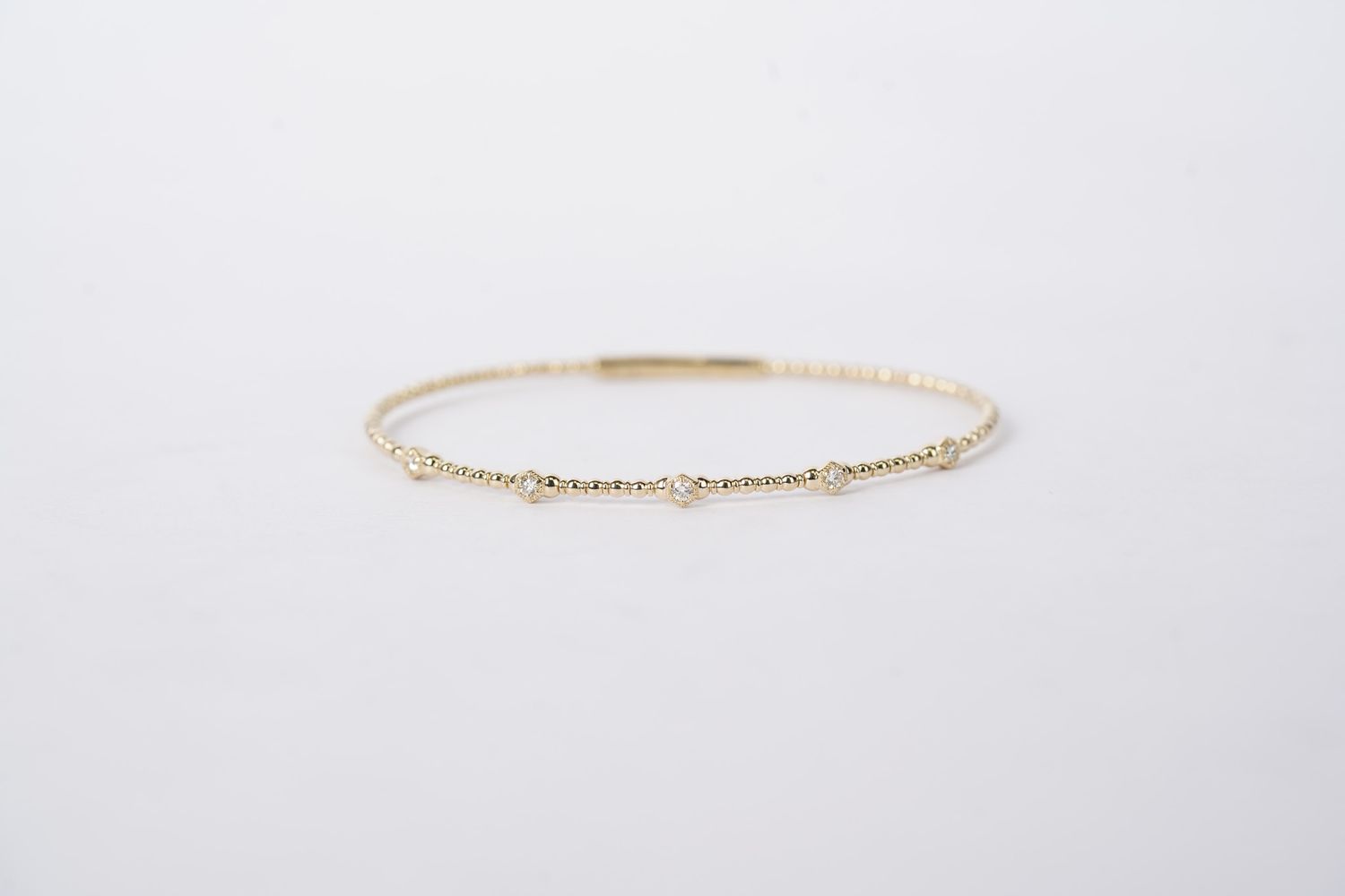RTTX- 14KY 4.70g .18ctw Diamond Flex Bangle
