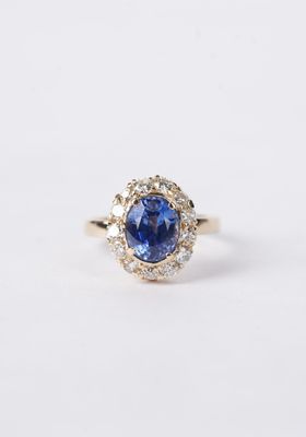 3.20 Carat Blue Sapphire with Diamond Halo Antique Ring in 14k Yellow Gold 3.20 Carat Blue Sapphire with Diamond Halo Antique Ring in 14k Yellow Gold