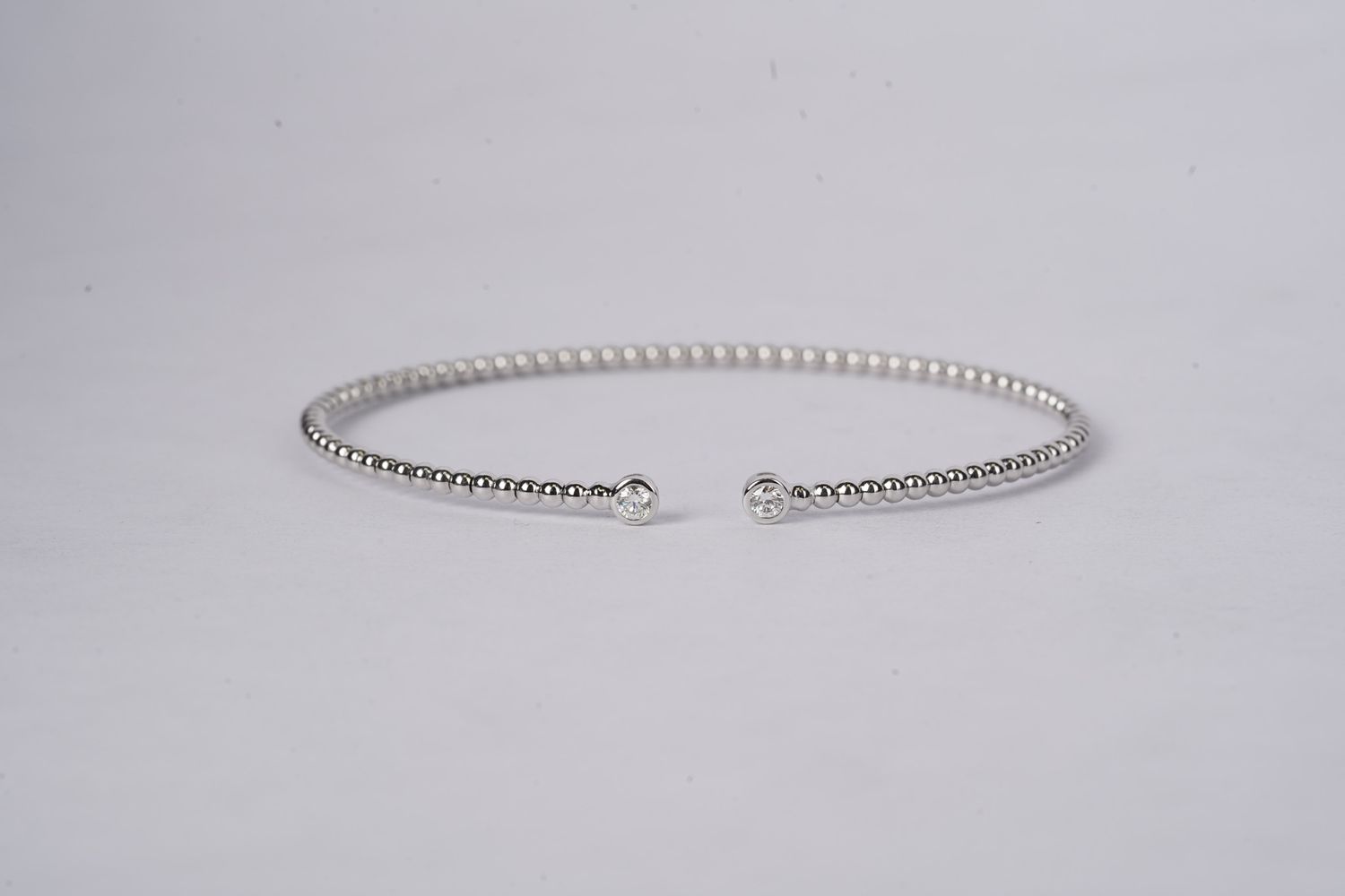 NLTX- 14KW 1.82g .13ctw Open Diamond Bezel Set Bangle Bracelet