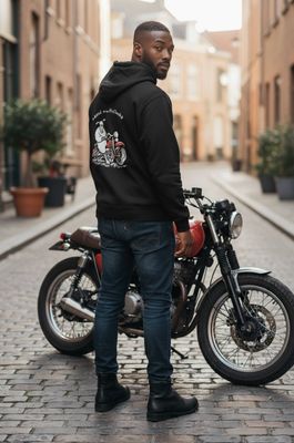 Man in the middle of street with red motorbike, wearing a hoodie that has the same motorbike on it from Baaad Flockers