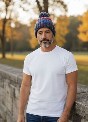 Man wearing woolly bobble hat made by Baaad Flockers standing outside 