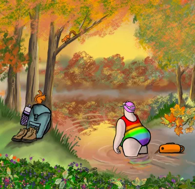 Woman in rainbow swimsuit padding in lake with autumn trees around