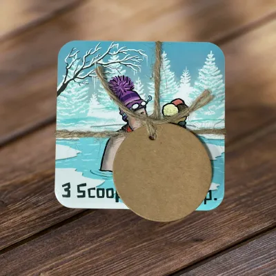 Image of coaster set wrapped in tweed string with a gift label