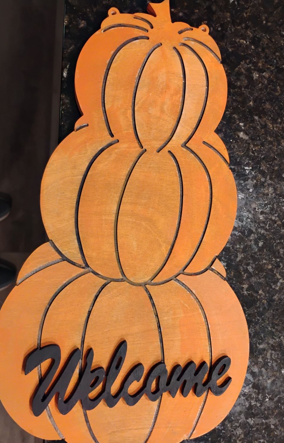 Stacked pumpkins with leaves and acorns