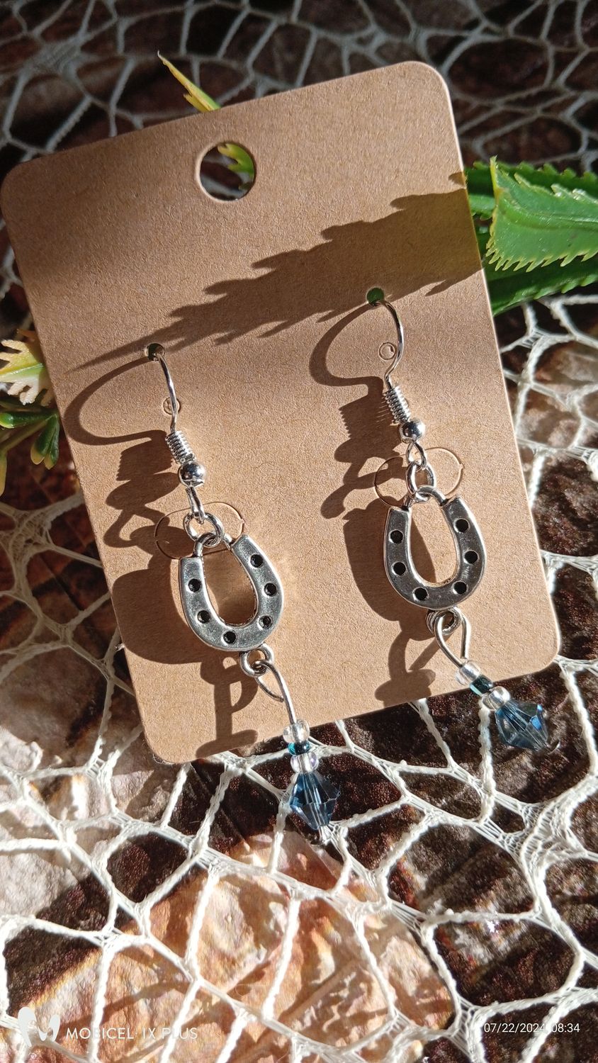 Silver Horse Shoe earrings with dangling Bead