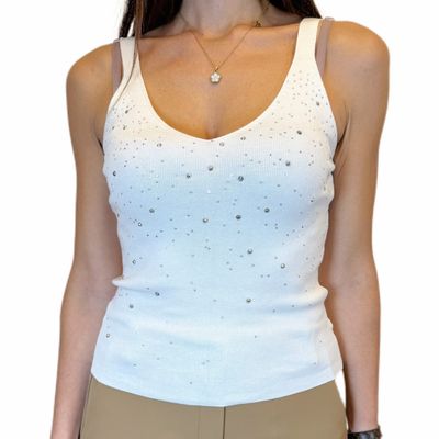 Top in maglia bianca con paillettes