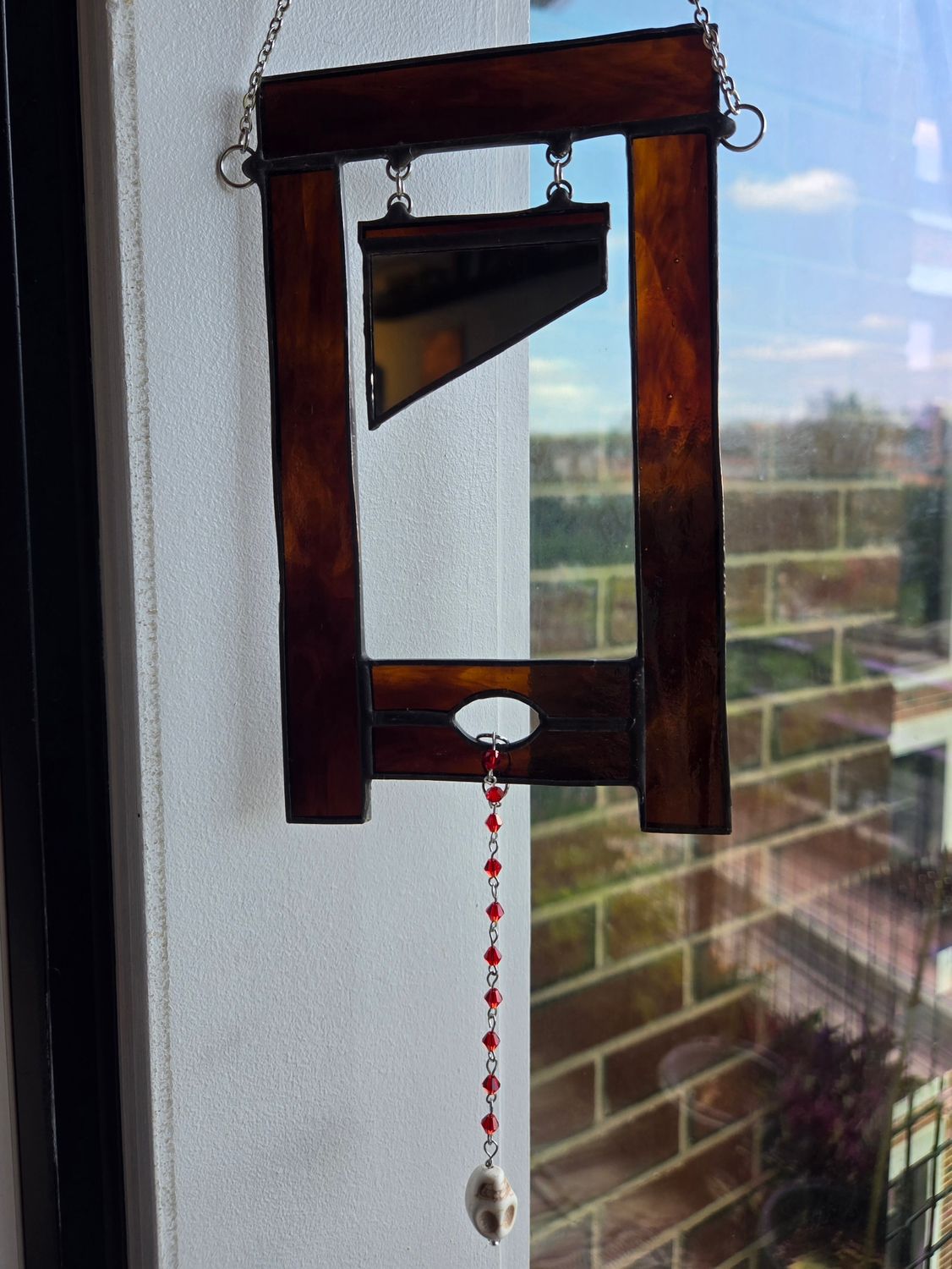 Guillotine Suncatcher (Brown)