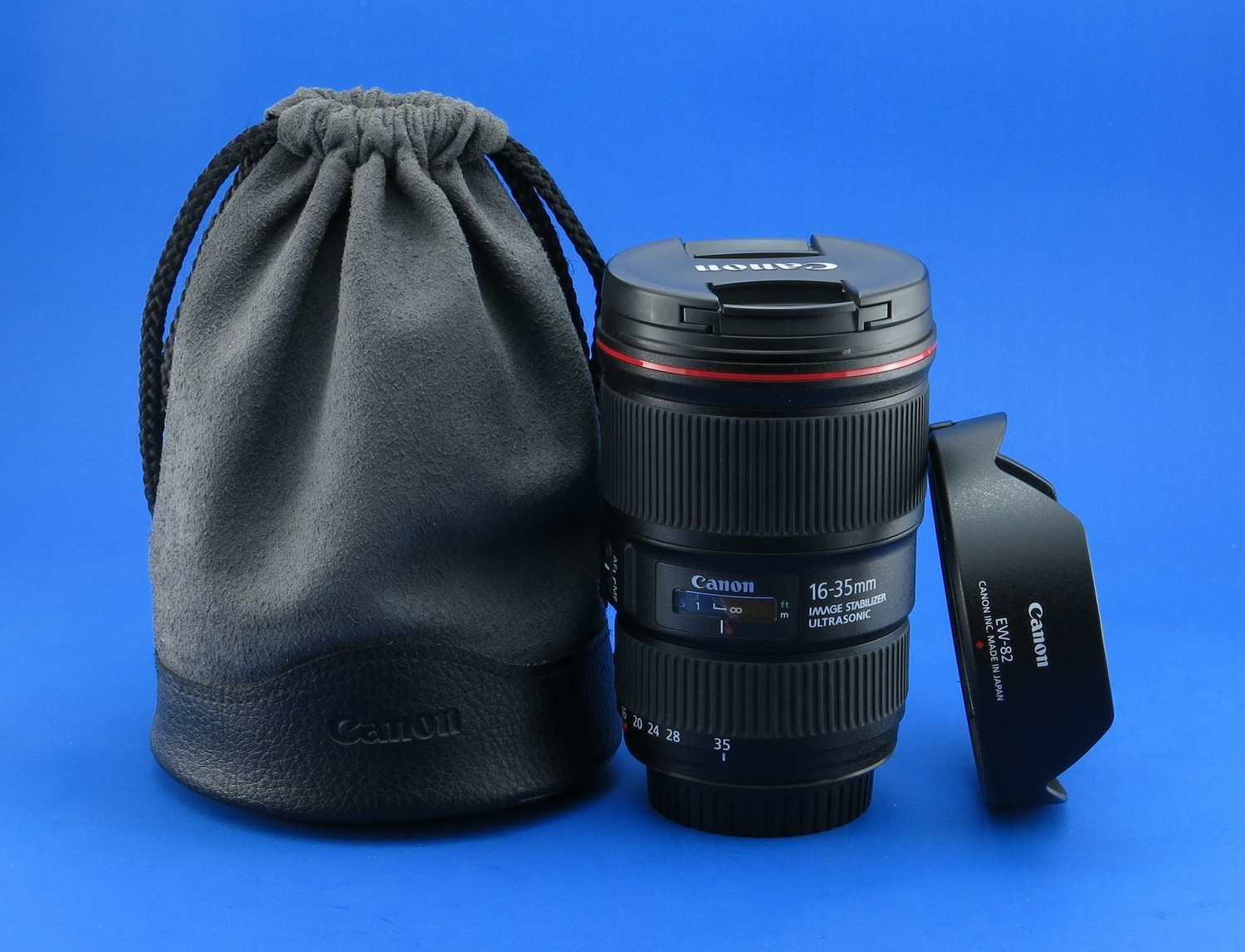 Canon 16-35 f4 L IS USM. Tapas, parasol, bolso