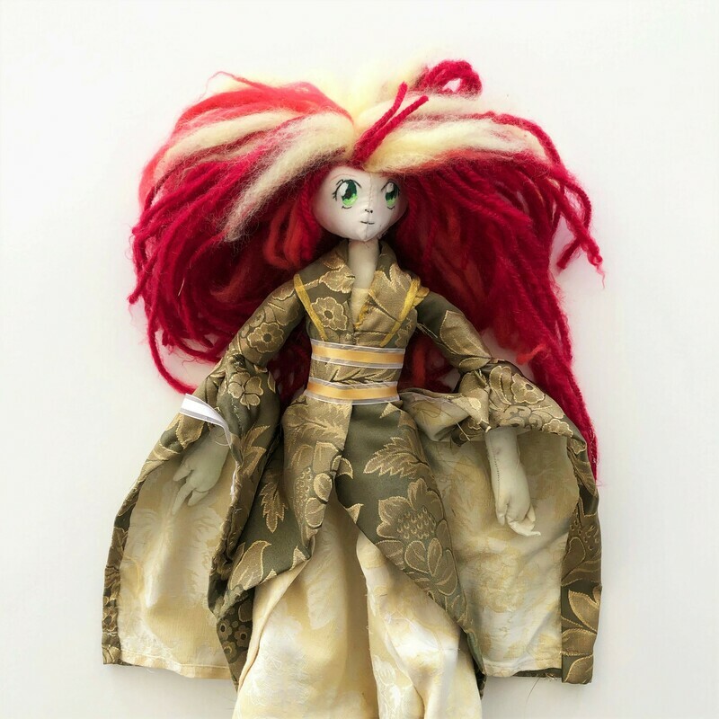 Light Flower is a 20&quot; anime inspired doll. The doll has long red yarn hair with blonde highlights extending down from her crown. She has large green eyes and a small mouth and nose. The doll wears a green and yellow flower print kimono made from a table cloth. Her kimono is held together by a yellow and white ribbon. Her outfiti&#39;s completed with her green gloves.
