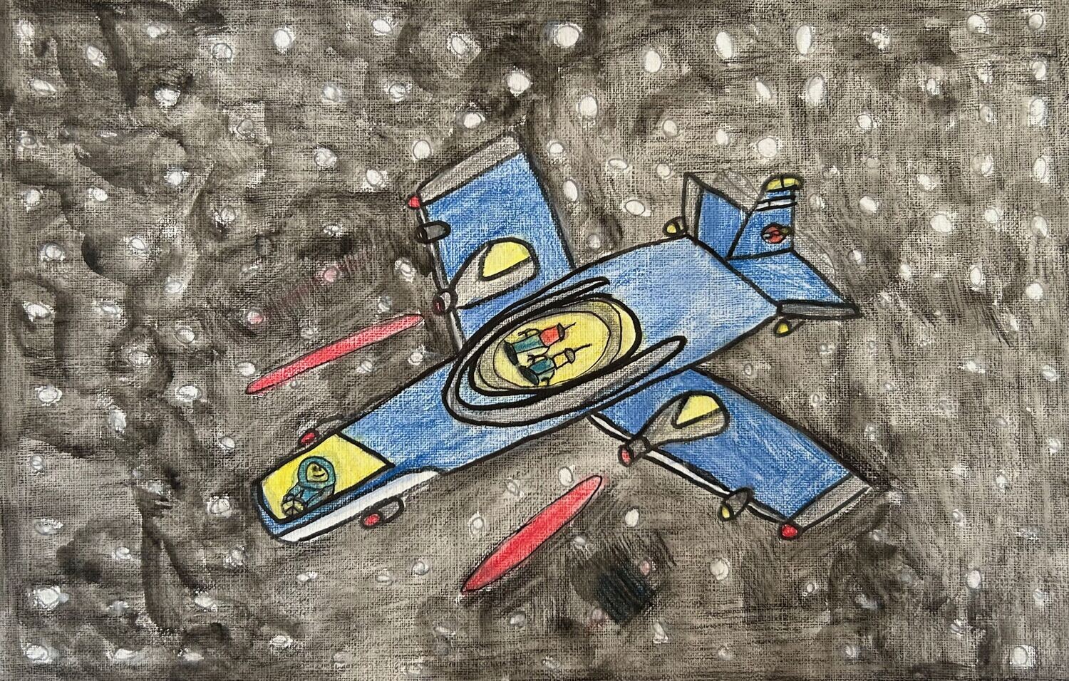 A large blue and yellow space ship is centered on a brown background with many white spots representing stars.  The spaceship has two people inside a yellow dome in the middle of it.  In the front of the spaceship under another yellow dome is another person.  There are red flames coming out of the spaceship. 