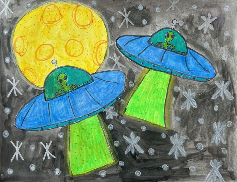 On a  gray and black background sits 2 blue and green UFOs.  There is a large yellow asteroid in the upper left corner.  Each spaceship is being piloted by a small green alien.  There are white stars scattered throughout the space.