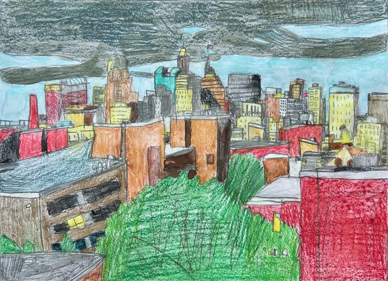 Skyline of Baltimore shows a blue sky with dark clouds.  It shows about 20 different buildings of various colors.   In the foreground is a large tree.
