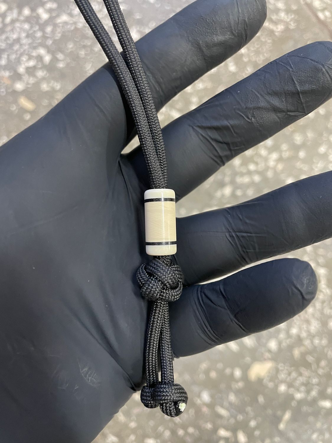 Handmade mammoth tusk lanyard bead for knife – unique prehistoric material detail