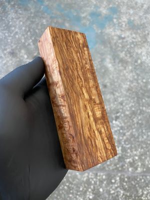 Stabilized Karelian birch wood block knife handle material close grain detail