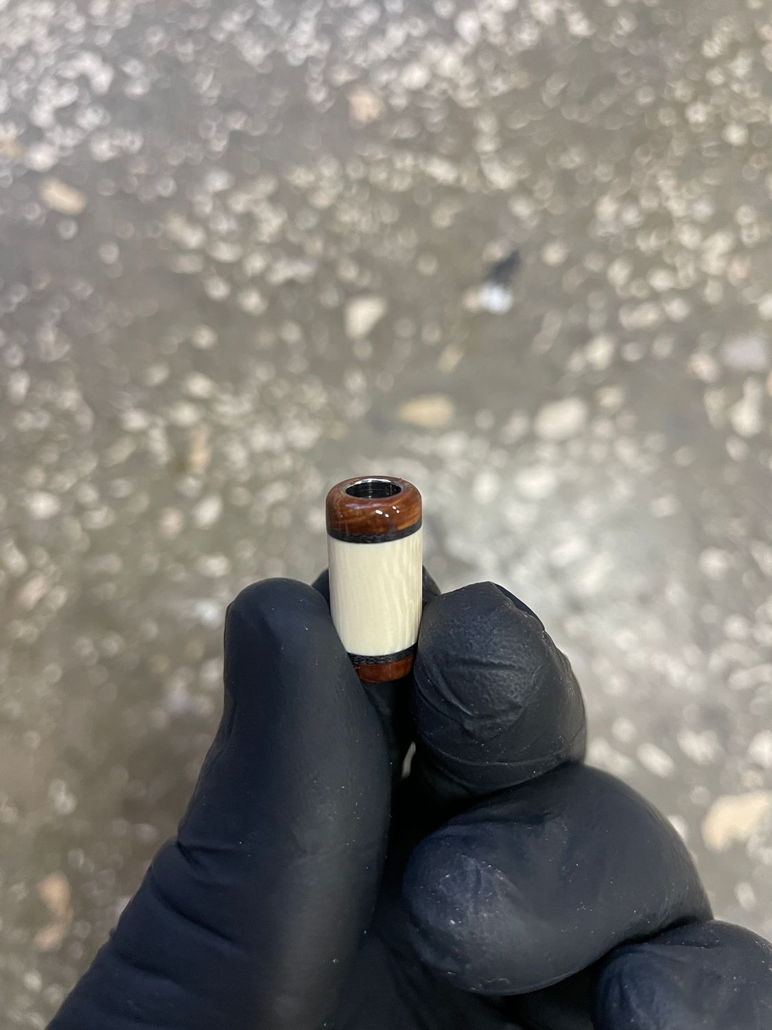 Mammoth tooth and tusk knife lanyard bead with G10 accents – stabilized fossil ivory bead close-up BE4