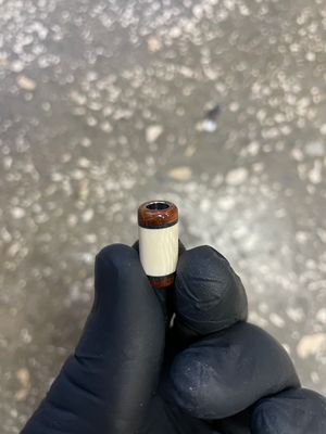 Mammoth tooth and tusk knife lanyard bead with G10 accents – stabilized fossil ivory bead close-up BE4