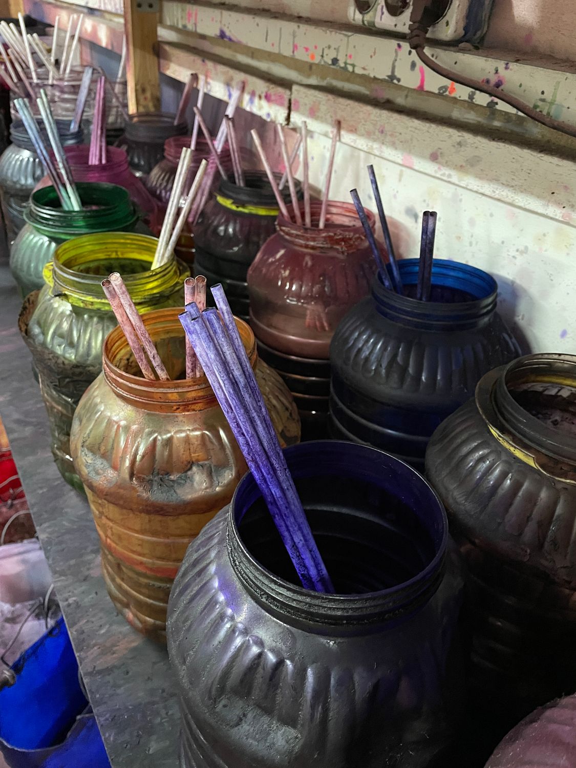Colored Cactus Juice stabilizing resin in plastic containers, prepared for dyeing and stabilizing wood blocks