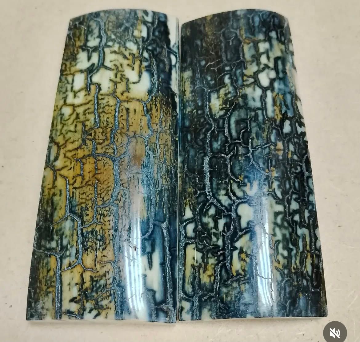 Pair of blue mammoth bark ivory knife scales with natural blue, cream, and dark mineral patterns.