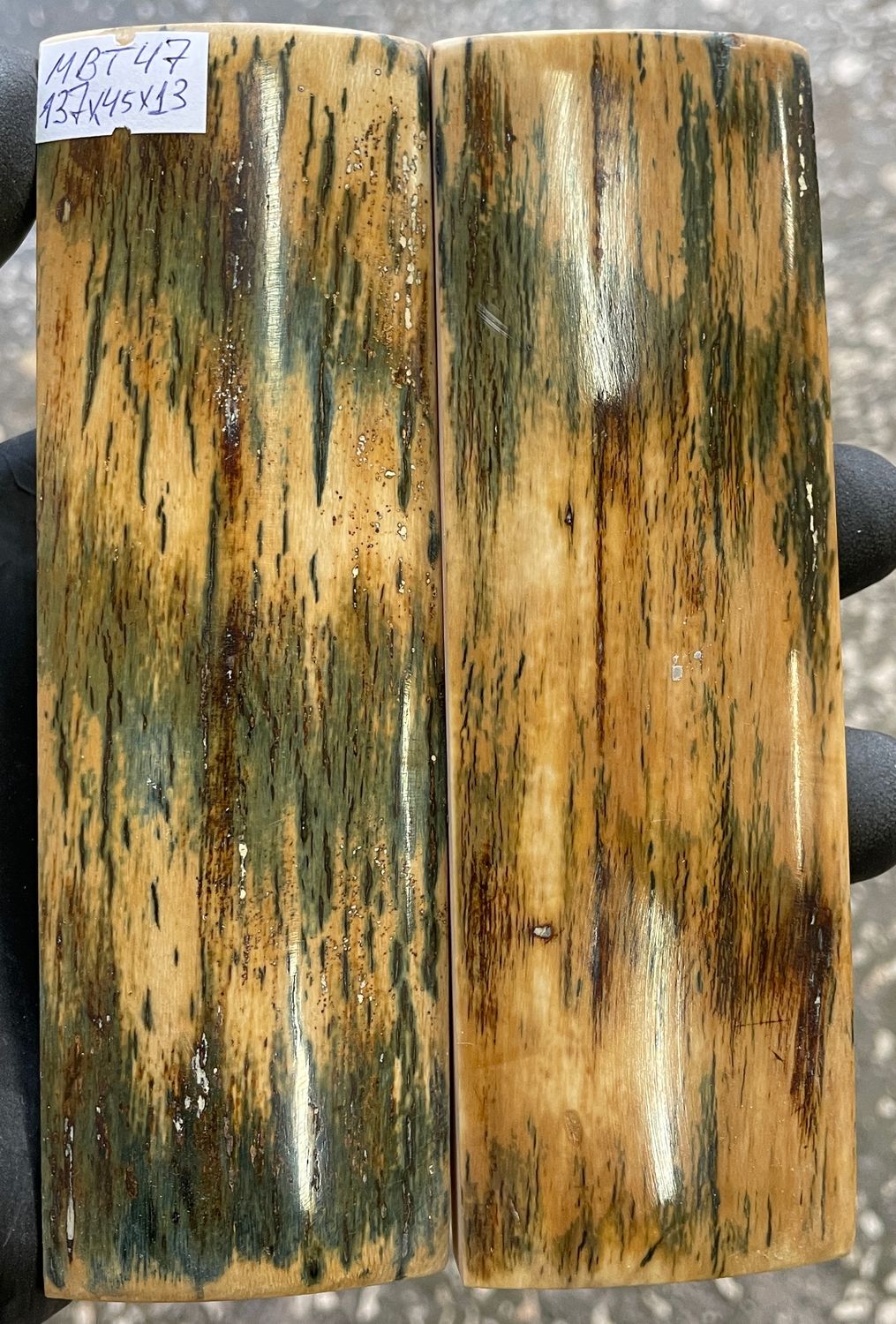 Pair of green mammoth bark ivory knife scales with natural green, brown, and cream mineral patterns.