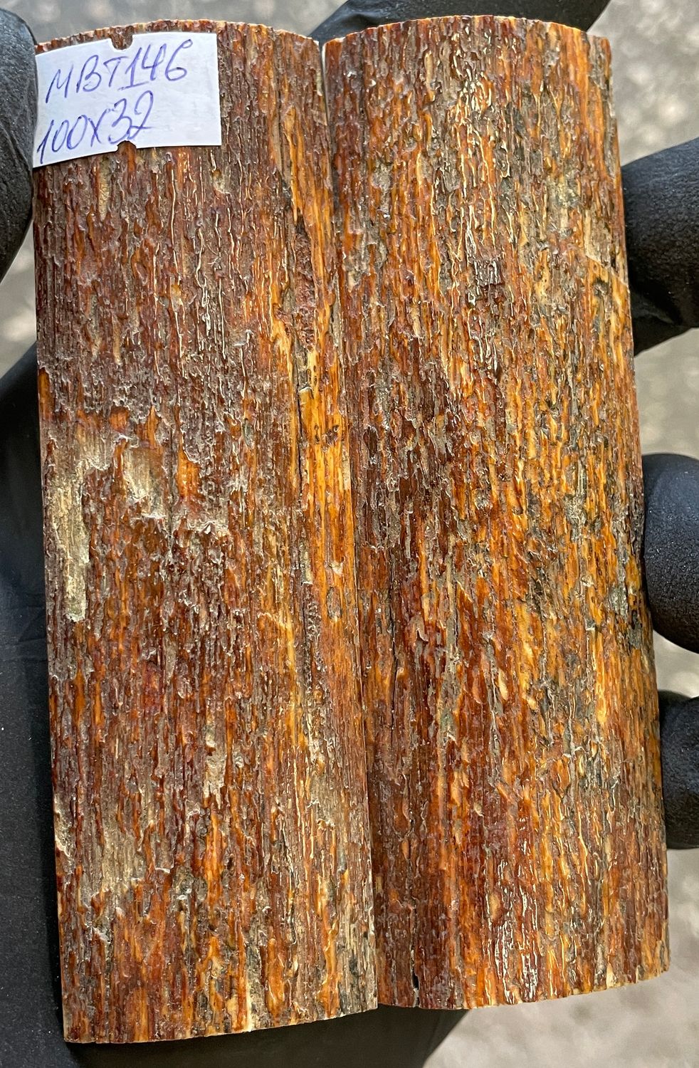 Pair of reddish-brown mammoth bark ivory knife scales with natural brown, red, and cream coloration.