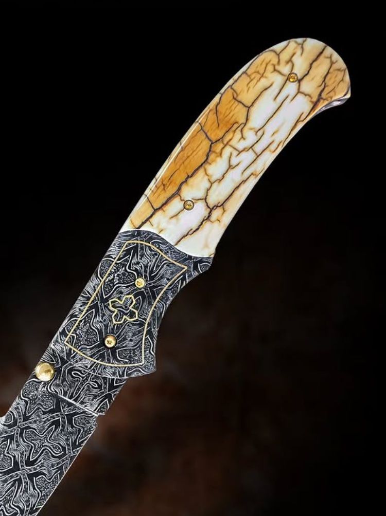Custom collectible knife with a mammoth bark ivory handle featuring a natural wood-like texture.