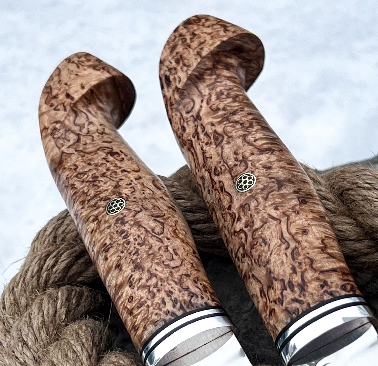 Custom knife featuring a richly figured Karelian birch handle with unique natural grain