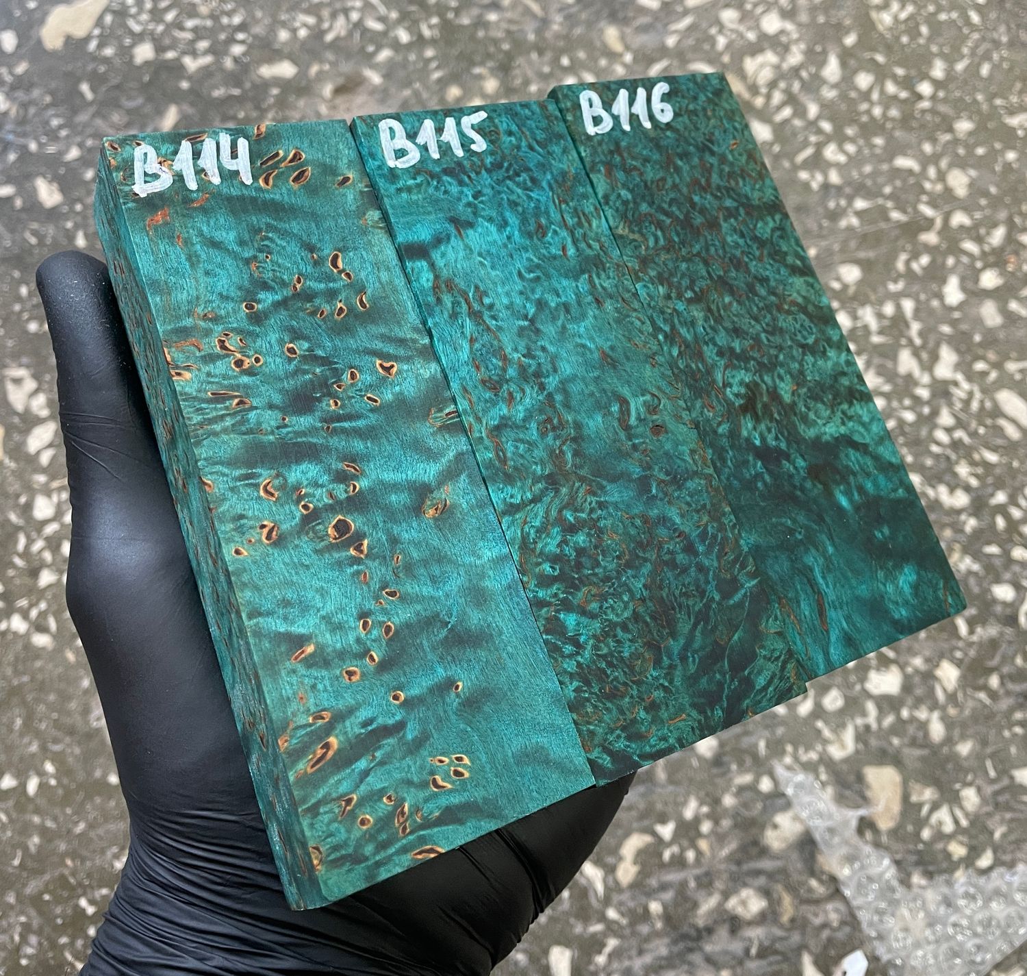 Turquoise stabilized Karelian birch wood with distinctive figured grain