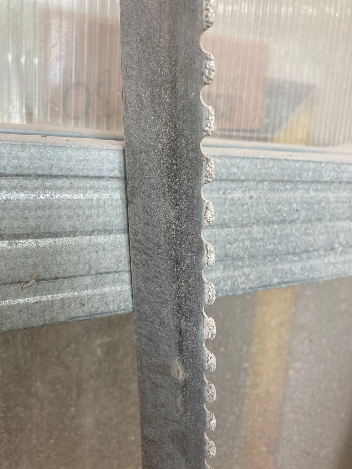 Carbide-tipped bandsaw blade used for cutting a stabilized mammoth tooth block into knife handle scales..
