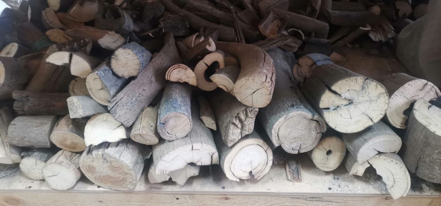 Freshly cut stabilized mammoth tooth pieces after processing on a water-cooled stone-cutting saw for custom knife handles.