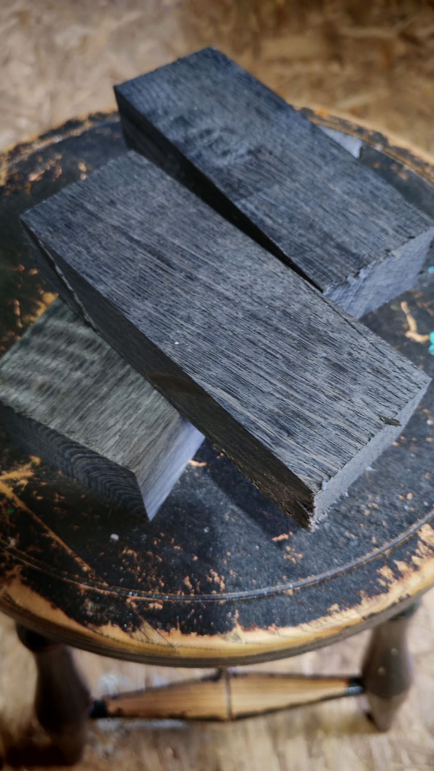 Bog oak blocks showing distinctive grain patterns and natural dark wood texture