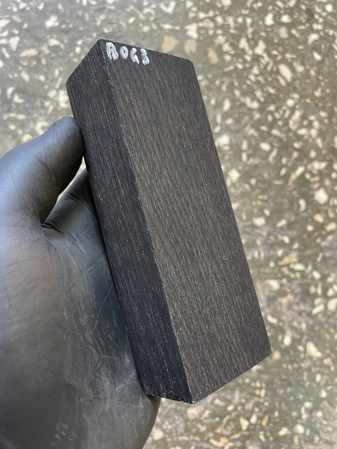 Stabilized bog oak knife scales with deep black color and natural ancient wood grain, matched pair for custom knife handles.