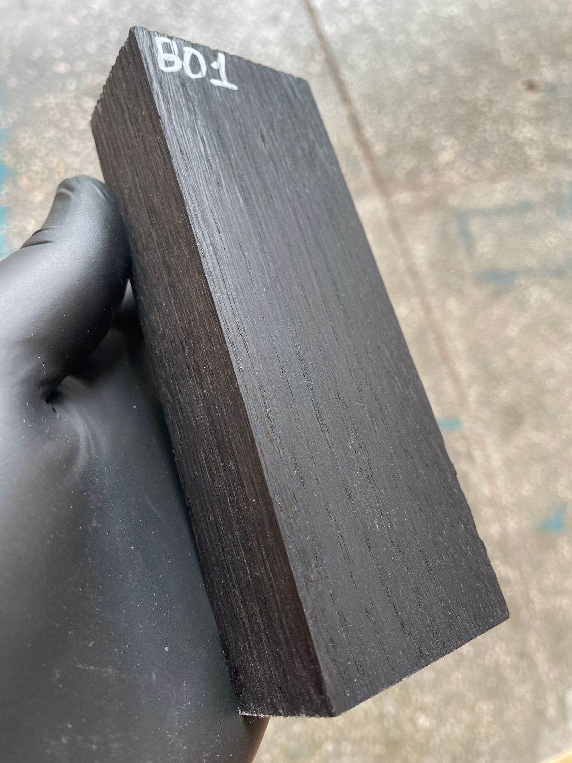 Matched pair of stabilized bog oak knife scales with natural prehistoric wood figure, ready for custom knife projects.