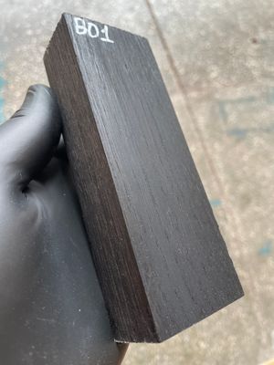 Matched pair of stabilized bog oak knife scales with natural prehistoric wood figure, ready for custom knife projects.