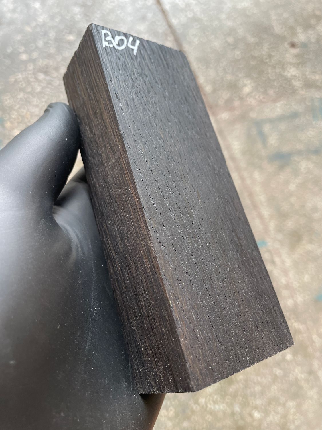 Matched pair of stabilized bog oak knife scales with natural prehistoric wood figure, ready for custom knife projects.