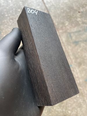 Matched pair of stabilized bog oak knife scales with natural prehistoric wood figure, ready for custom knife projects.