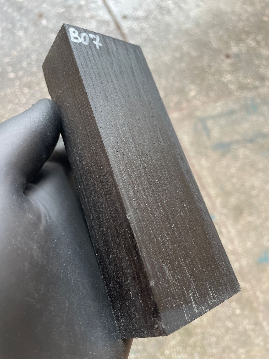 Matched pair of stabilized bog oak knife scales with natural prehistoric wood figure, ready for custom knife projects.
